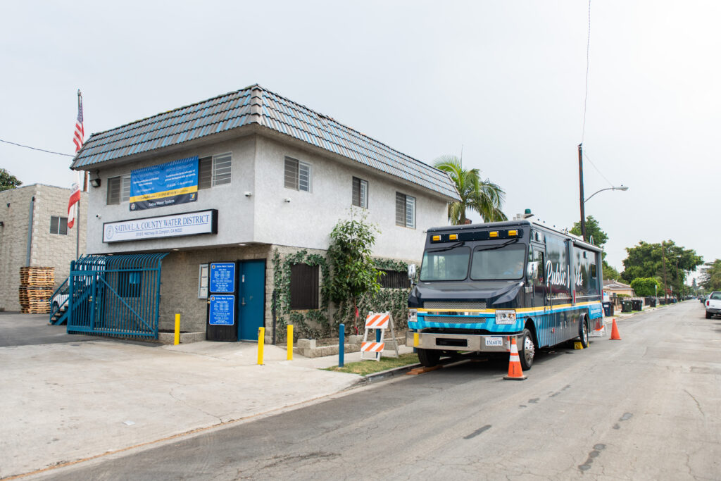 Public Works van in front of building